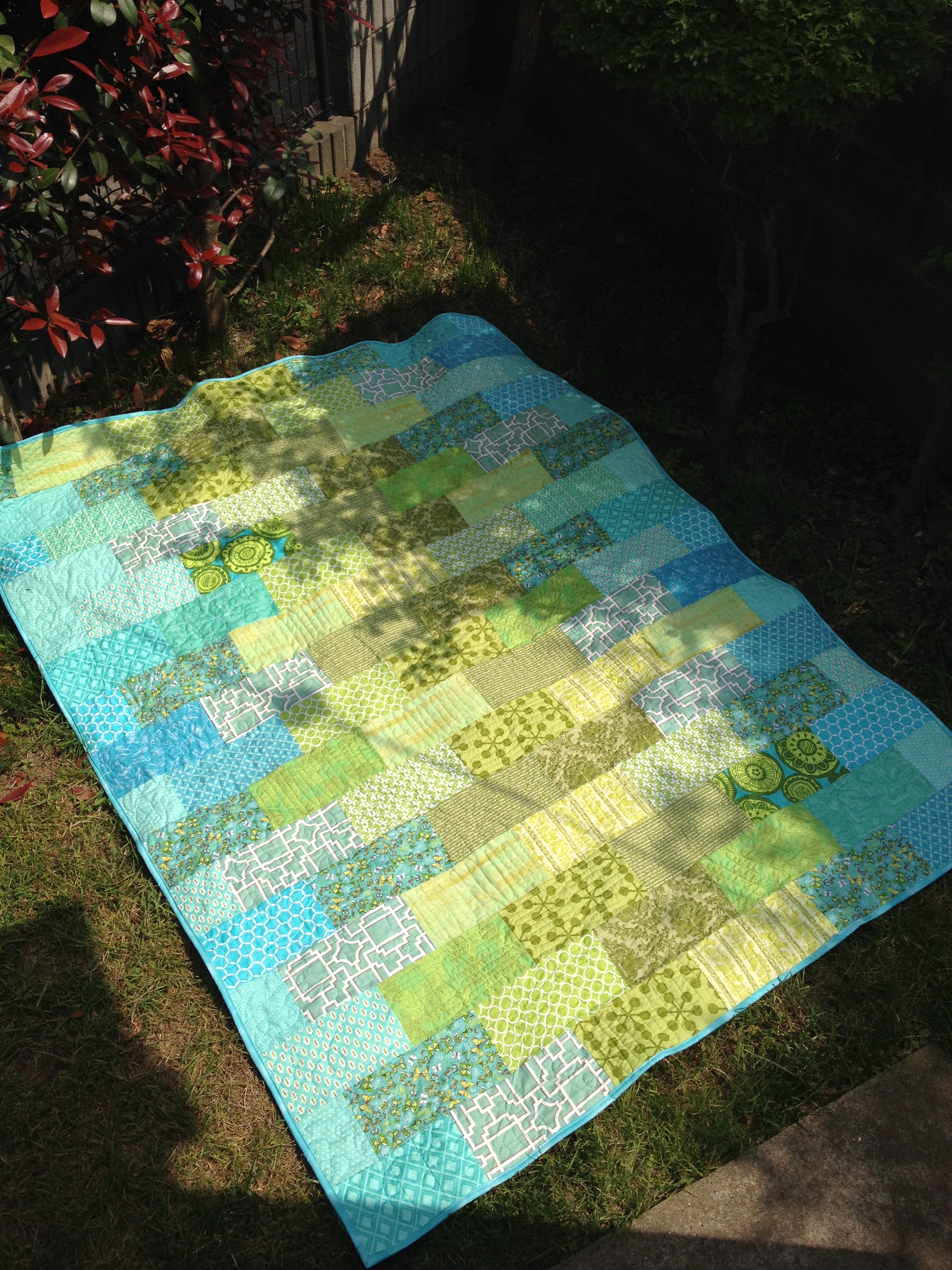 Blue and green patchwork quilt