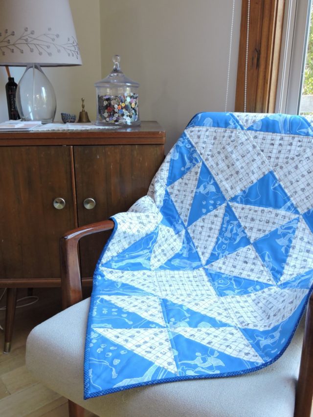 A big block baby quilt using Snowflake quilt pattern by BlossomHeartQuilts.com