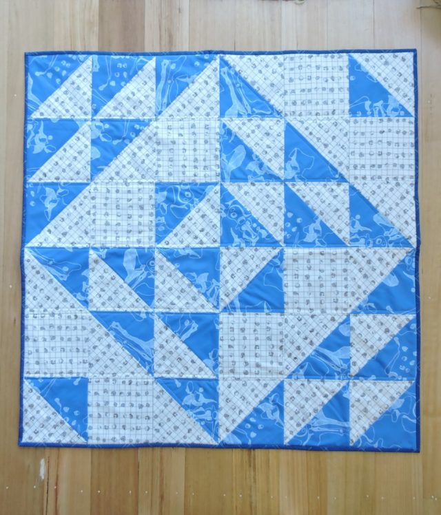 A big block baby quilt using Snowflake quilt pattern by BlossomHeartQuilts.com