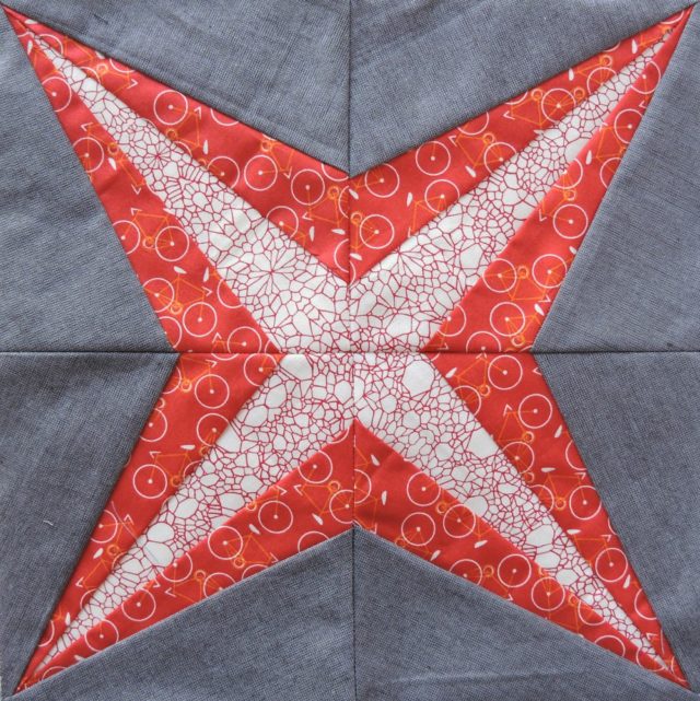 Alpha Centauri quilt block from the Milky Way Sampler at BlossomHeartQuilts.com