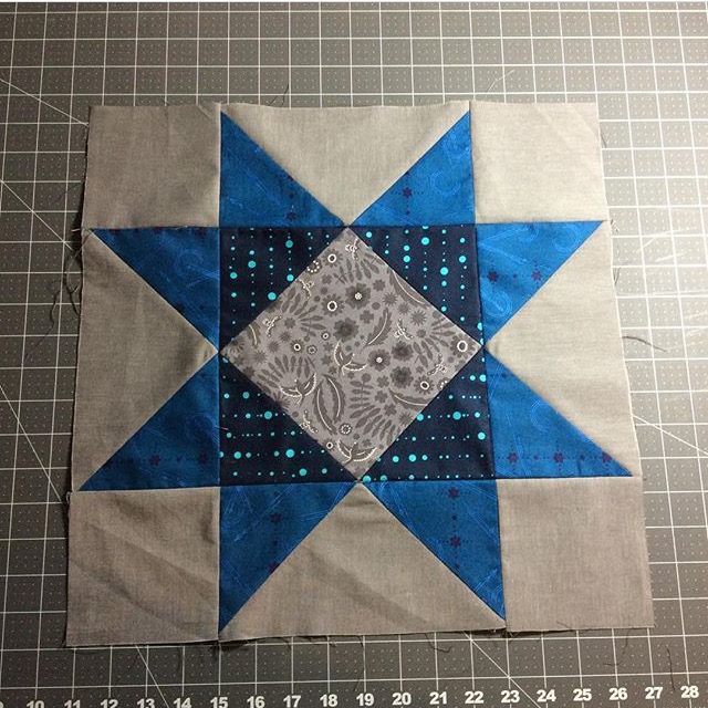 A beautiful blue star quilt block made from the Aurora BOM by BlossomHeartQuilts.com