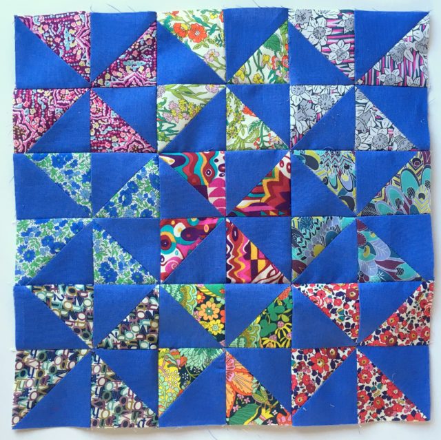 Nine 4in Liberty pinwheel blocks by BlossomHeartQuilts.com