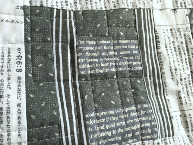 Fussy cutting Japanese text fabric in a quilt block by BlossomHeartQuilts.com