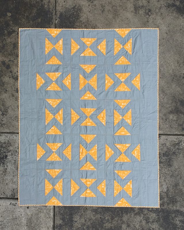 Directional quilt pattern by BlossomHeartQuilts.com using flying geese