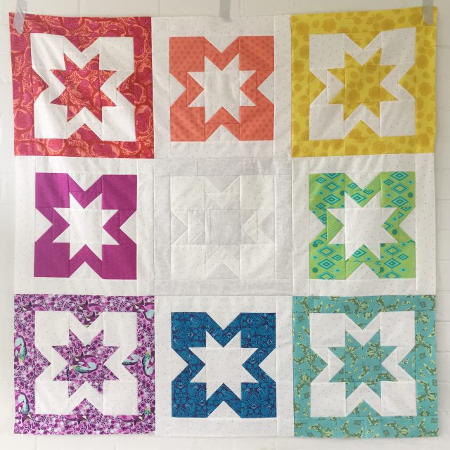 Tula Pink rainbow Geode quilt by BlossomHeartQuilts.com