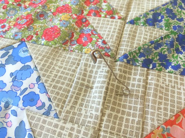 Pin basting a quilt