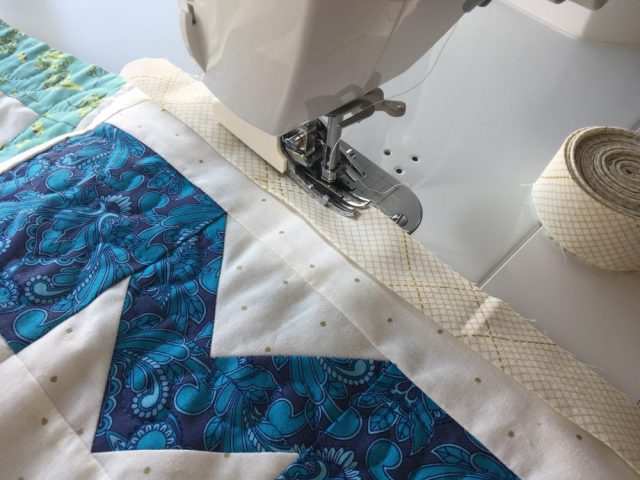 Sewing binding to the quilt