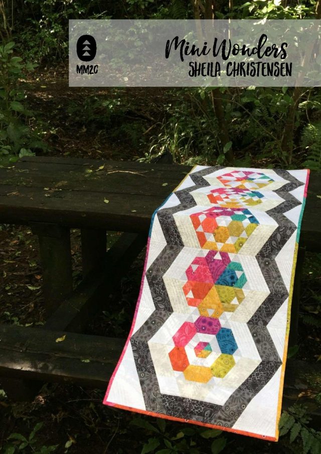 Alison Glass rainbow table runner with hexagons and triangles