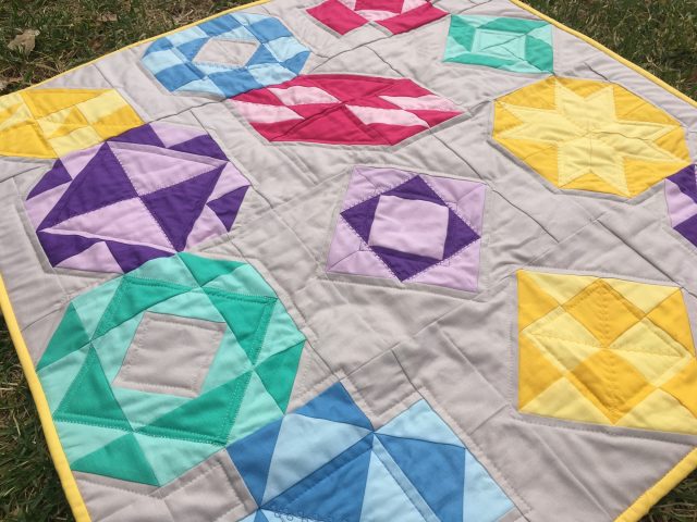 AccuQuilt Qube Block of the Month sampler quilt by BlossomHeartQuilts.com