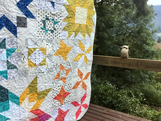 Alison Glass rainbow quilt using Aurora BOM by BlossomHeartQuilts.com