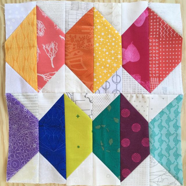 Abacus scrappy quilt block in warm and cool brights using the tutorial by BlossomHeartQuilts.com