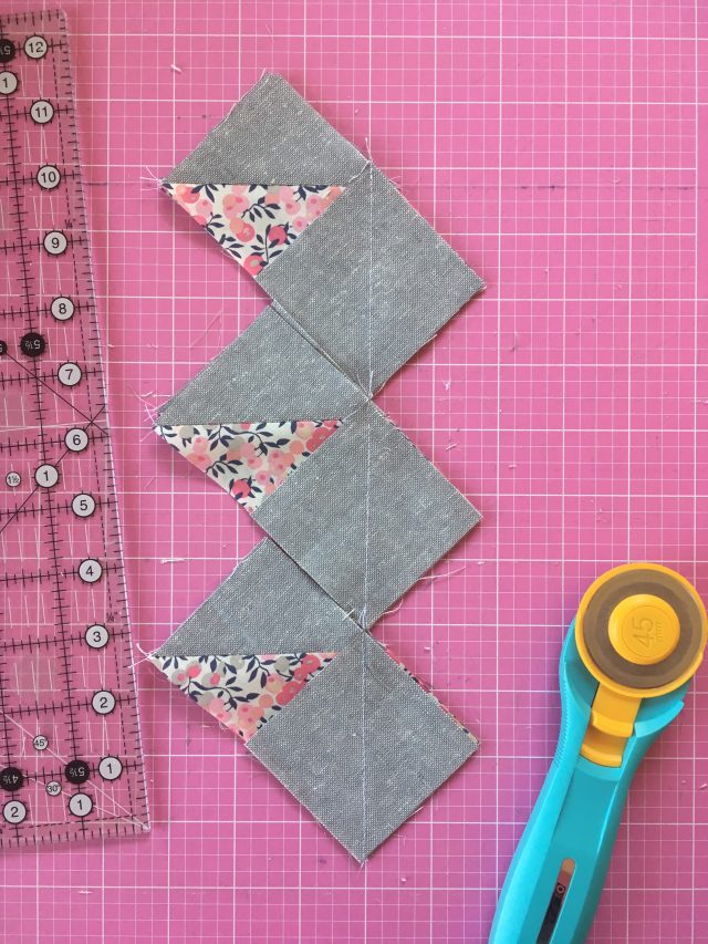 How to trim bulk flying geese units from the flying geese tips by BlossomHeartQuilts.com