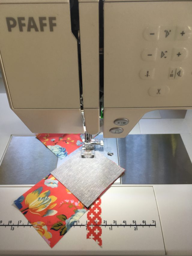 Using washi tape to sew bulk flying geese units from the flying geese tips by BlossomHeartQuilts.com