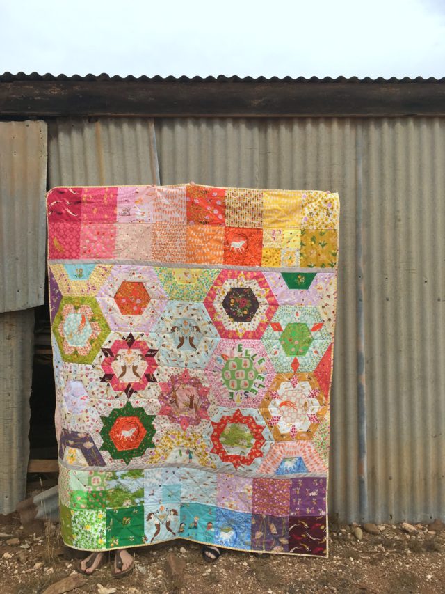 A Heather Ross patchwork and EPP quilt by BlossomHeartQuilts.com
