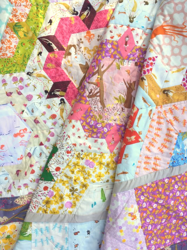 A quilt using Heather Ross fabrics by BlossomHeartQuilts.com