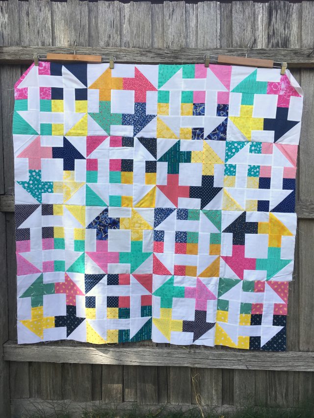 Scrappy double churn dash quilt by BlossomHeartQuilts.com
