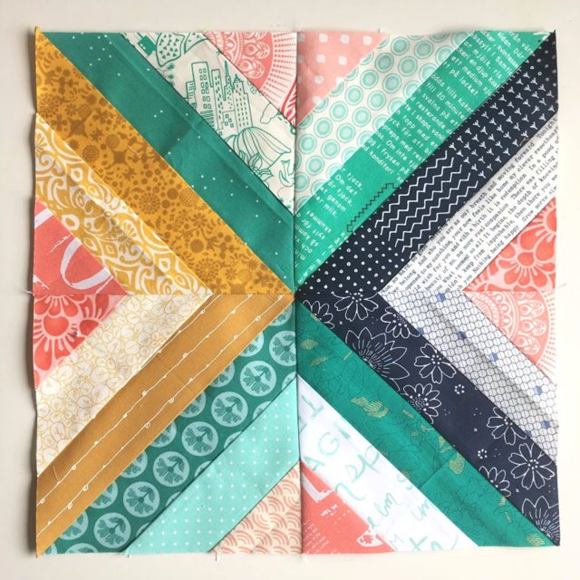 Treasure Hunt quilt block in navy, mustard, teal and coral by BlossomHeartQuilts.com