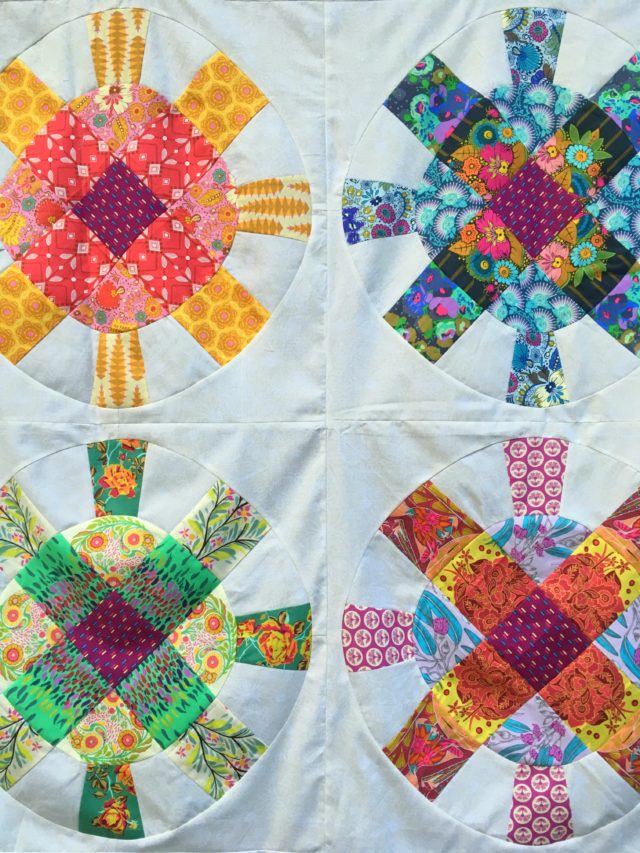 Colourful modern baby quilt