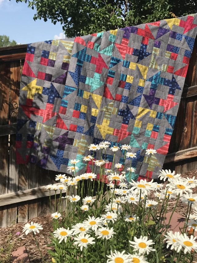 Modern churn dash quilt