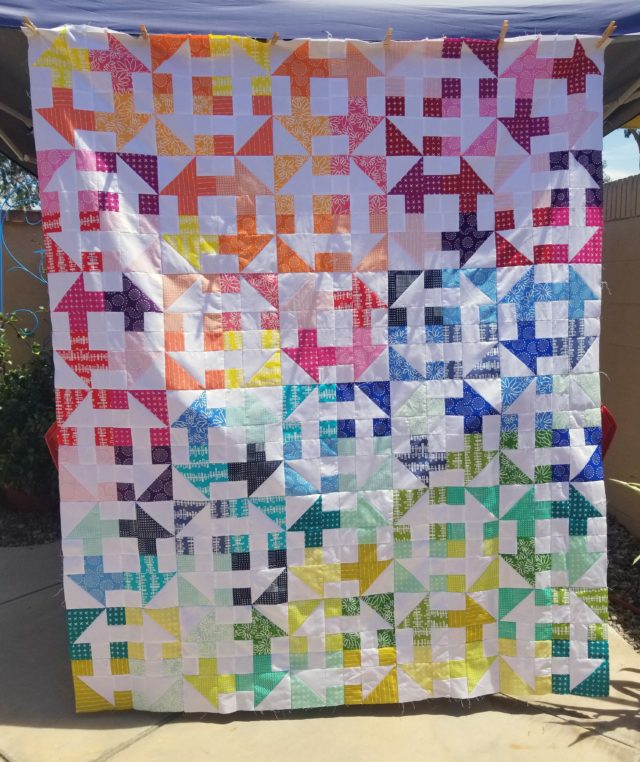 Rainbow churn dash quilt