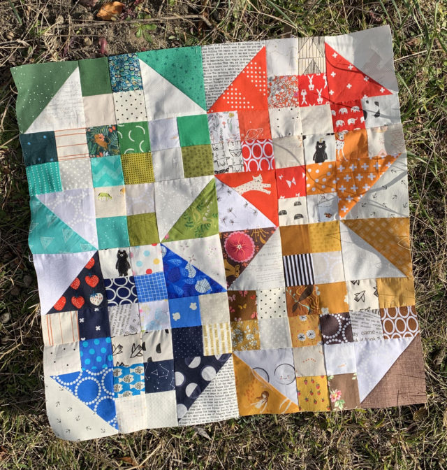 Scrappy churn dash quilt