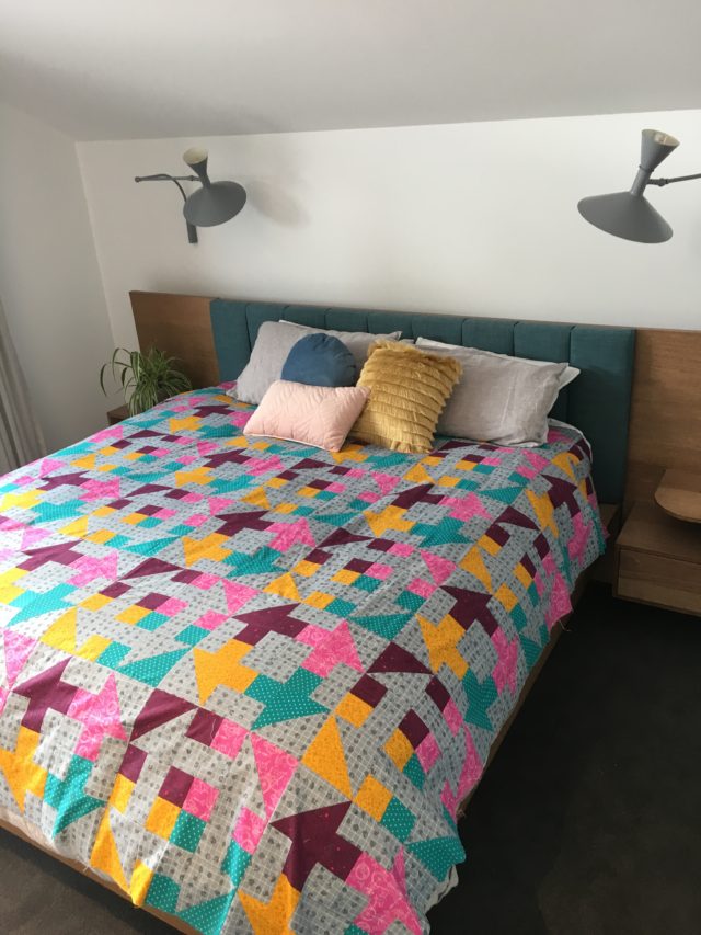 Modern churn dash quilt