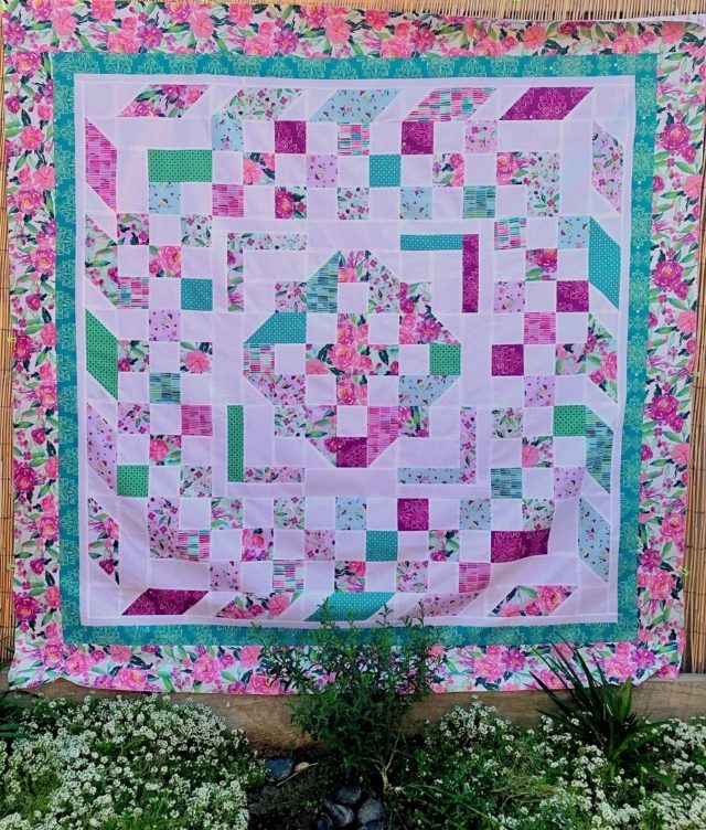 Pink, purple and teal quilt