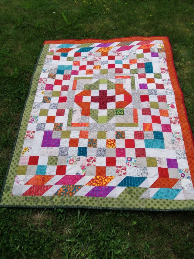 Bright scrappy medallion quilt