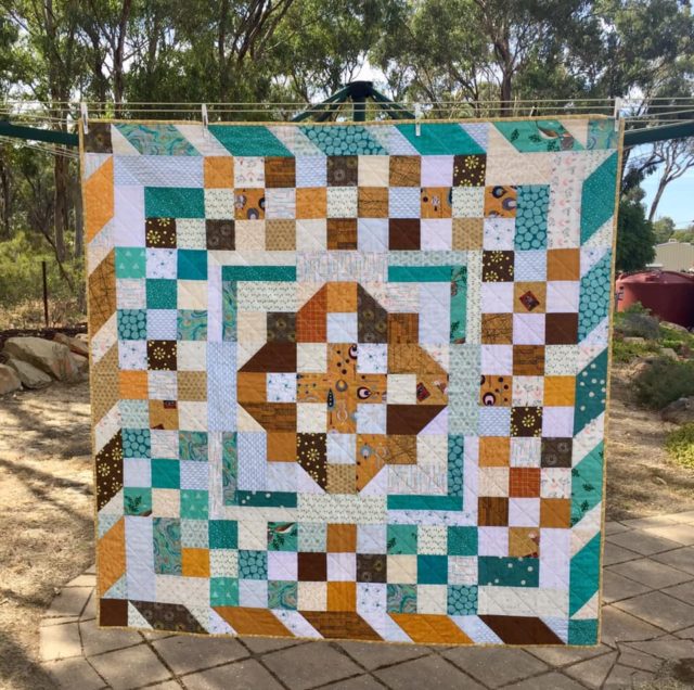 Mustard and teal quilt