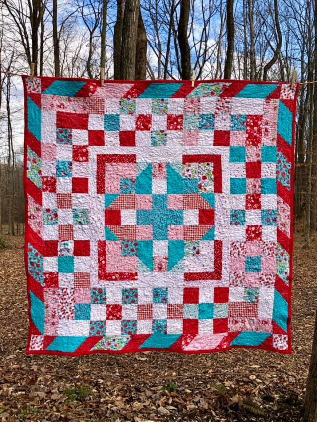 Teal, pink and red quilt