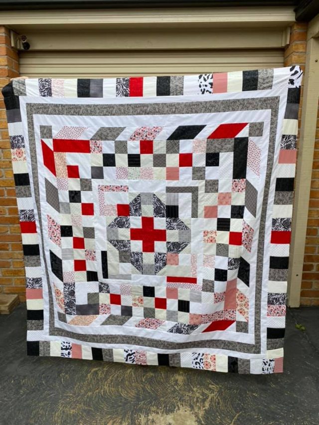 Black, red and white quilt