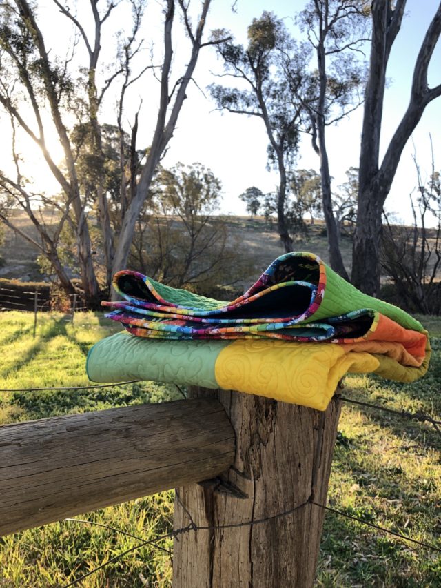 Rainbow binding on a quilt