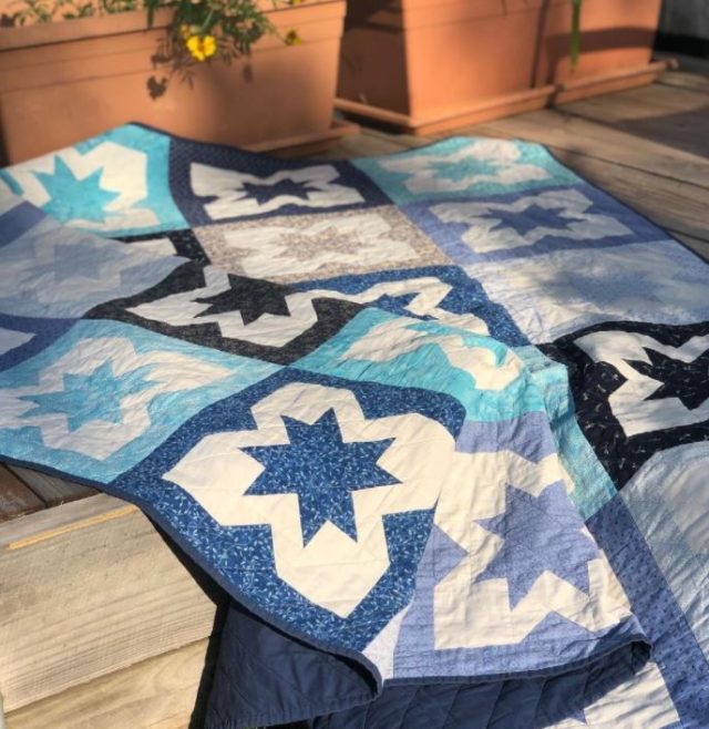 Blue and white star quilt