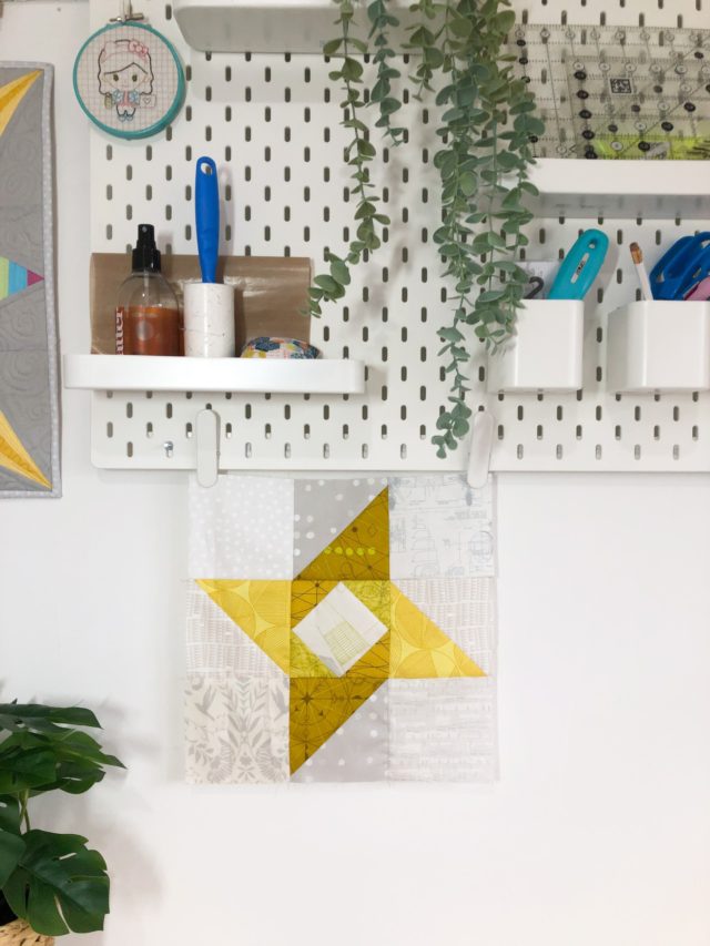 Scrappy green star quilt block